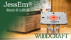 JessEm Rout-R-Lift II router lift mounted on a workbench next to its packaging box in a workshop setting.