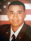 Portrait of a U.S. veteran in military uniform with American flag background, related to woodturning business.