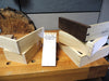 Stacked wooden boxes showcasing dovetail joints with a note dated July 21, 2014, from a Rob Cosman class.