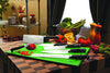 Set of ZHEN kitchen knives with black handles displayed on green cutting mats alongside sliced bell peppers and fresh