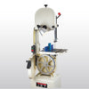Jet bandsaw with cast iron table, wheel guard, and attached work light in workshop setting