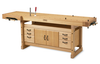 Solid wood workbench with integrated drawers, cabinet storage, and dual vises for woodworking tasks